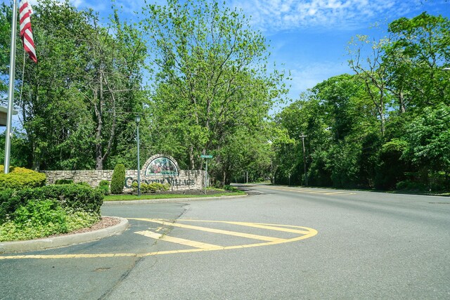 192 Theodore Dr, Coram, NY 11727 - view of asphalt street featuring curbs and street lighting