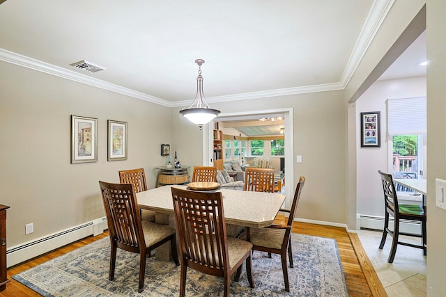 10 Cregan Pl, Monroe, NY 10950 - dining space with baseboard heating, ornamental molding, light wood-style floors, and baseboards