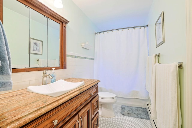 10 Cregan Pl, Monroe, NY 10950 - bathroom featuring vanity, toilet, tile walls, tile patterned flooring, and a wainscoted wall