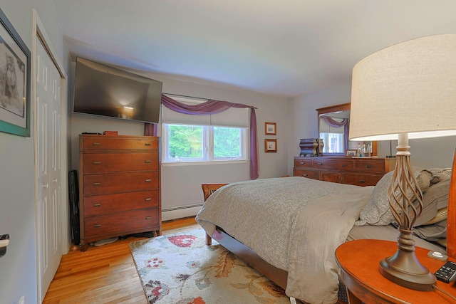 10 Cregan Pl, Monroe, NY 10950 - bedroom with a baseboard radiator, light wood-style flooring, and a closet