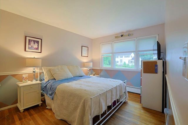 10 Cregan Pl, Monroe, NY 10950 - bedroom featuring wood finished floors and baseboard heating