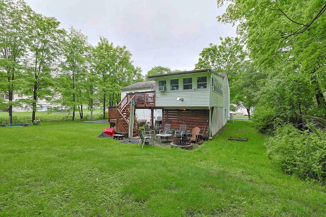 10 Cregan Pl, Monroe, NY 10950 - back of house with stairway, a fire pit, a wooden deck, and a lawn