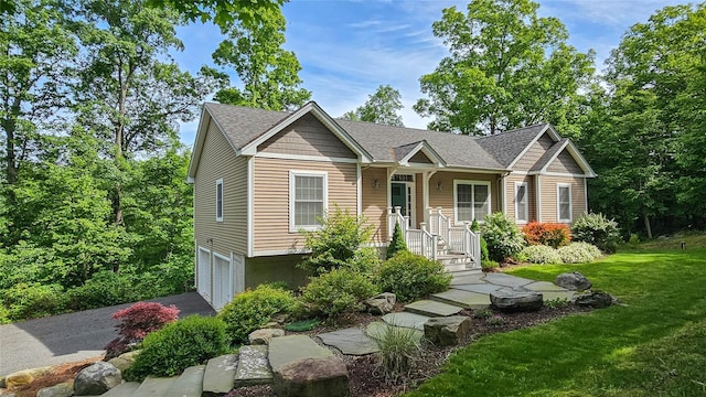 72 Greencrest Rd, Goshen, NY 10924 - view of front of home with an attached garage, a front lawn, asphalt driveway, and a shingled roof