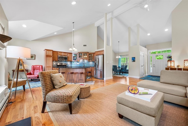 72 Greencrest Rd, Goshen, NY 10924 - living area with high vaulted ceiling, a chandelier, light wood-type flooring, baseboards, and beamed ceiling