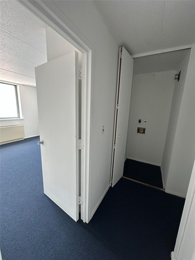 97-12 63rd Dr Unit 10D, Rego Park, NY 11374 - hallway with dark colored carpet and a textured ceiling