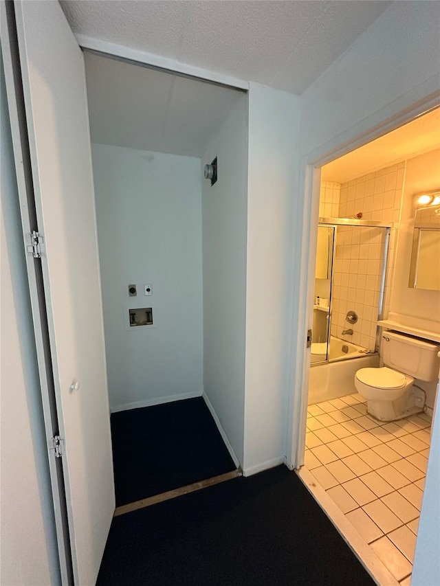 97-12 63rd Dr Unit 10D, Rego Park, NY 11374 - full bath featuring bath / shower combo with glass door and tile patterned flooring