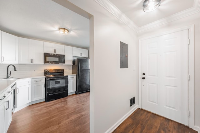 8 Moore Ln, Washingtonville, NY 10992 - kitchen featuring black appliances, a sink, electric panel, dark wood finished floors, and backsplash