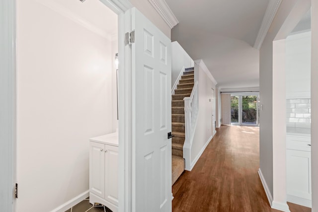 8 Moore Ln, Washingtonville, NY 10992 - corridor featuring baseboards, dark wood finished floors, stairway, and crown molding