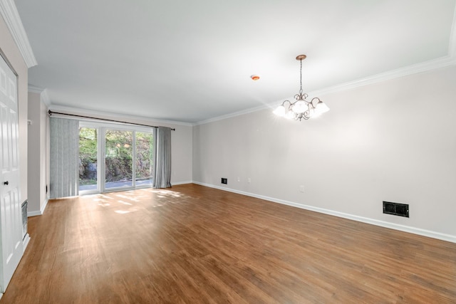 8 Moore Ln, Washingtonville, NY 10992 - empty room with crown molding, baseboards, wood finished floors, and a chandelier