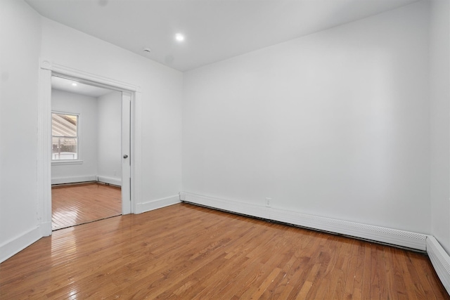 419 S 7th Ave, Mount Vernon, NY 10550 - unfurnished room with light wood finished floors, baseboard heating, and baseboards