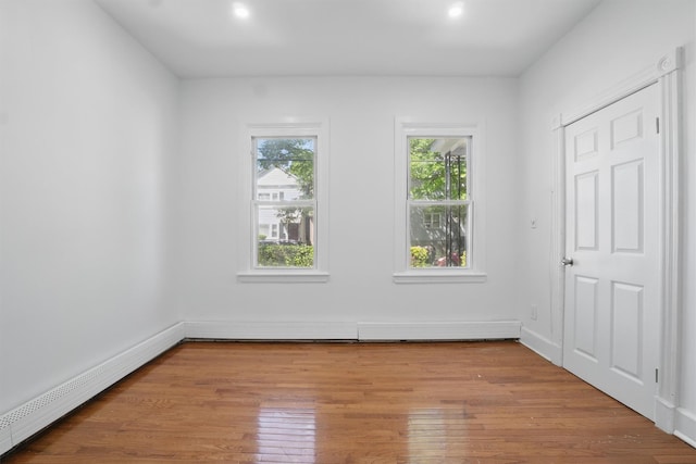 419 S 7th Ave, Mount Vernon, NY 10550 - unfurnished bedroom featuring wood finished floors, baseboards, and recessed lighting