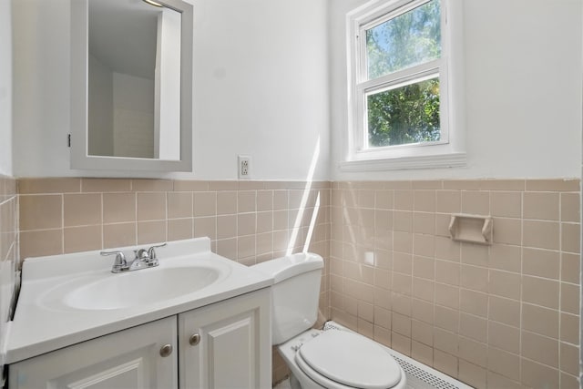 419 S 7th Ave, Mount Vernon, NY 10550 - bathroom featuring tile walls, vanity, toilet, and wainscoting