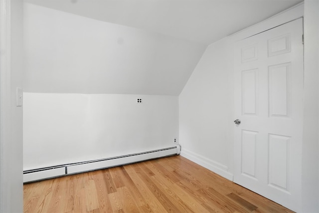 419 S 7th Ave, Mount Vernon, NY 10550 - additional living space featuring a baseboard heating unit, vaulted ceiling, wood finished floors, and baseboards