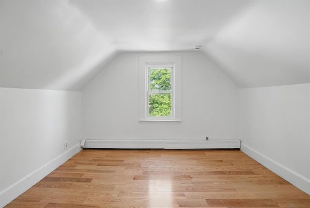 419 S 7th Ave, Mount Vernon, NY 10550 - additional living space featuring a baseboard radiator, vaulted ceiling, light wood-type flooring, and baseboards
