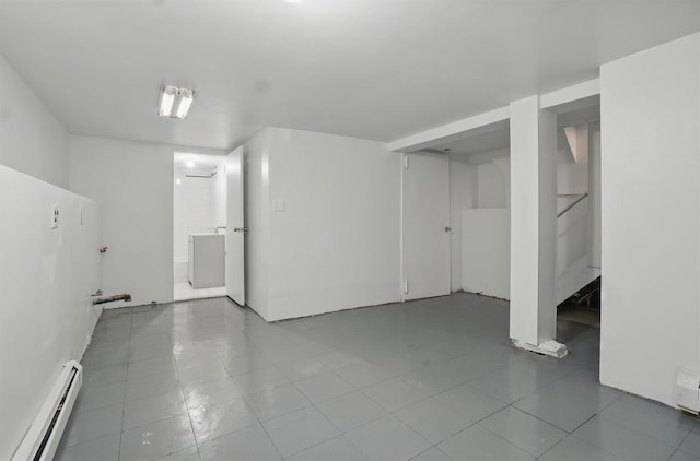 419 S 7th Ave, Mount Vernon, NY 10550 - finished basement with a baseboard radiator, tile patterned flooring, and washer / dryer