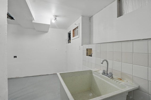 419 S 7th Ave, Mount Vernon, NY 10550 - bathroom featuring tile walls, a sink, and backsplash