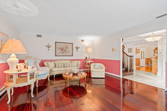 14 Battle Row, Old Bethpage, NY 11804 - living area with stairway, wood-type flooring, crown molding, baseboards, and a baseboard radiator