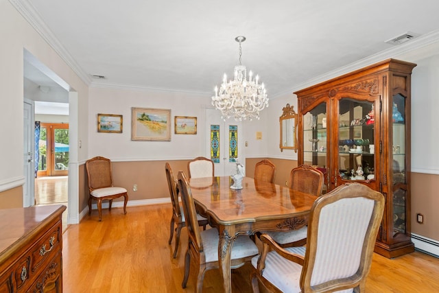 14 Battle Row, Old Bethpage, NY 11804 - dining area featuring french doors, light wood-type flooring, ornamental molding, a chandelier, and baseboard heating