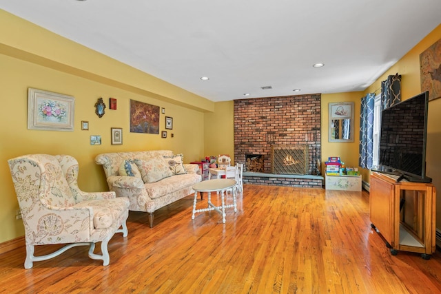 14 Battle Row, Old Bethpage, NY 11804 - living room with a fireplace, wood finished floors, and recessed lighting
