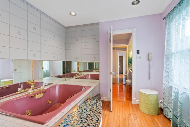 14 Battle Row, Old Bethpage, NY 11804 - bathroom with a whirlpool tub and wood finished floors