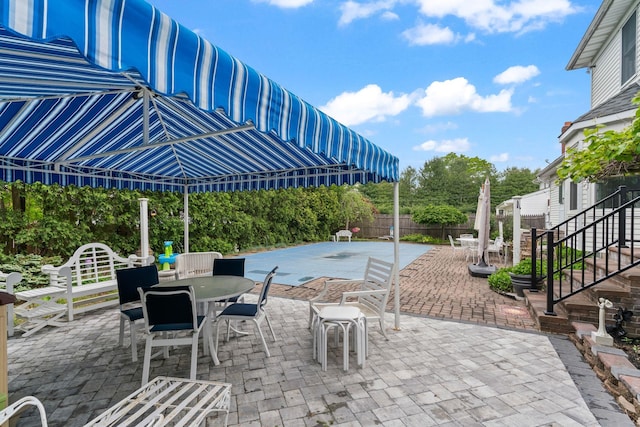 14 Battle Row, Old Bethpage, NY 11804 - fenced backyard featuring outdoor dining space, a patio area, and stairs