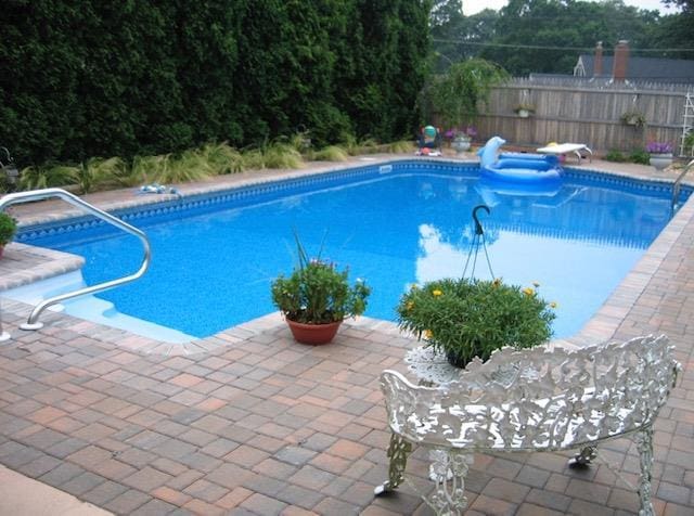 14 Battle Row, Old Bethpage, NY 11804 - view of pool featuring a patio