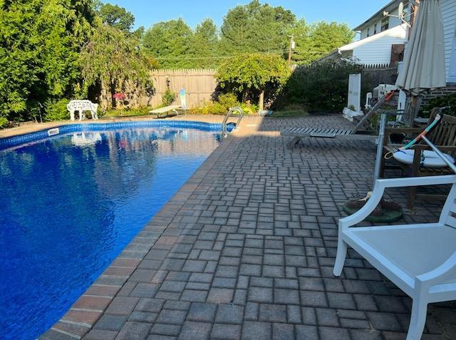 14 Battle Row, Old Bethpage, NY 11804 - view of swimming pool with a patio and a fenced backyard