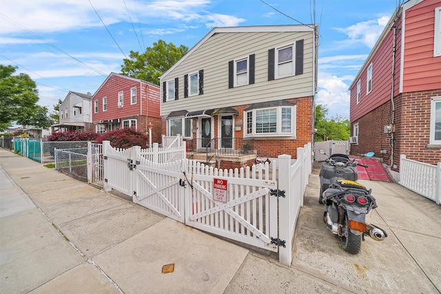 2808 Philip Ave, Bronx, NY 10465 - view of front facade with a gate, a fenced front yard, brick siding, and a residential view