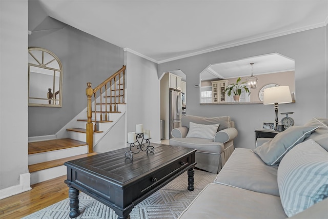 2808 Philip Ave, Bronx, NY 10465 - living room with wood finished floors, stairway, arched walkways, ornamental molding, and baseboards