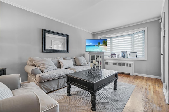 2808 Philip Ave, Bronx, NY 10465 - living area with radiator, light wood-style flooring, baseboards, and crown molding