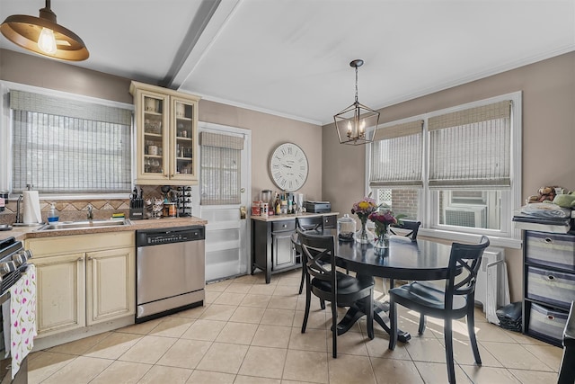 2808 Philip Ave, Bronx, NY 10465 - kitchen with stainless steel dishwasher, cream cabinetry, a sink, range with gas cooktop, and decorative backsplash