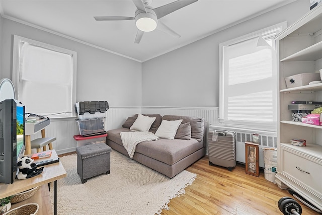 2808 Philip Ave, Bronx, NY 10465 - living room with wainscoting, ornamental molding, hardwood / wood-style floors, and ceiling fan