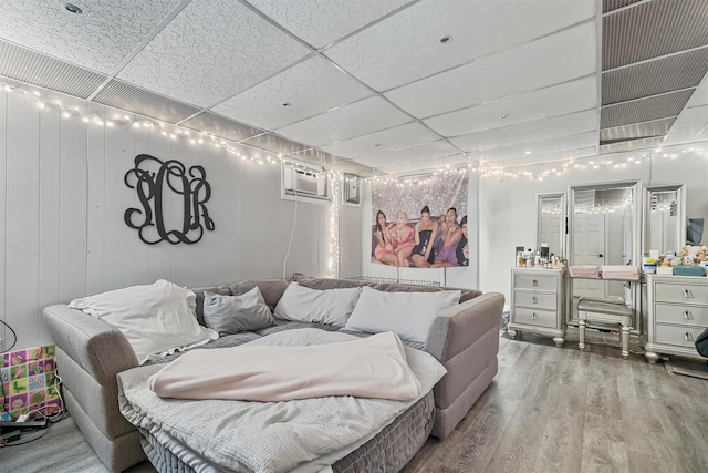 2808 Philip Ave, Bronx, NY 10465 - living room with a drop ceiling, wood finished floors, and a wall unit AC