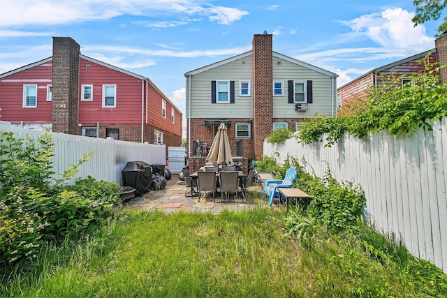 2808 Philip Ave, Bronx, NY 10465 - back of property featuring a patio, a fenced backyard, and brick siding