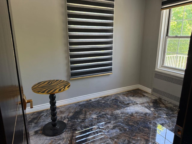 255 Central Ave Unit 202-A, Lawrence, NY 11559 - detailed view of radiator heating unit and baseboards