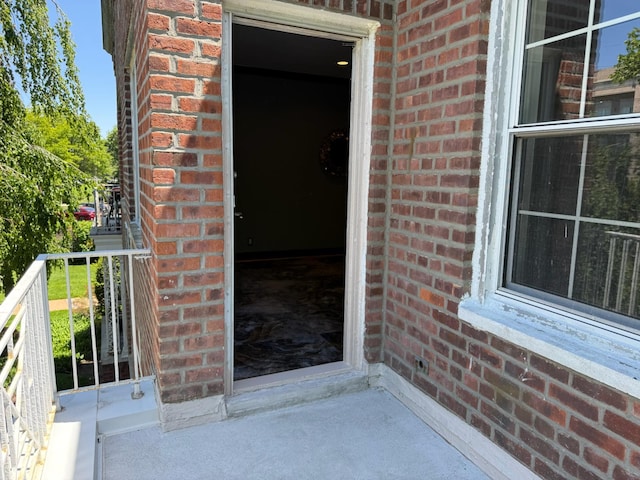 255 Central Ave Unit 202-A, Lawrence, NY 11559 - view of exterior entry featuring brick siding