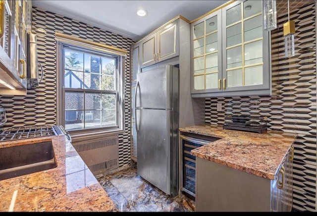 255 Central Ave Unit 202-A, Lawrence, NY 11559 - kitchen featuring freestanding refrigerator, radiator, tasteful backsplash, wine cooler, and recessed lighting