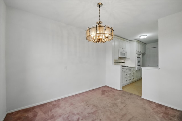 600 Locust St Unit 7C, Mount Vernon, NY 10552 - unfurnished room featuring a chandelier, light colored carpet, and baseboards