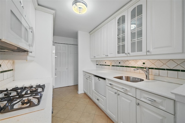 600 Locust St Unit 7C, Mount Vernon, NY 10552 - kitchen with white appliances, a sink, decorative backsplash, and white cabinetry
