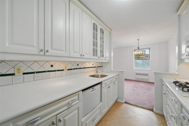 600 Locust St Unit 7C, Mount Vernon, NY 10552 - kitchen with radiator, a sink, white appliances, a chandelier, and glass insert cabinets