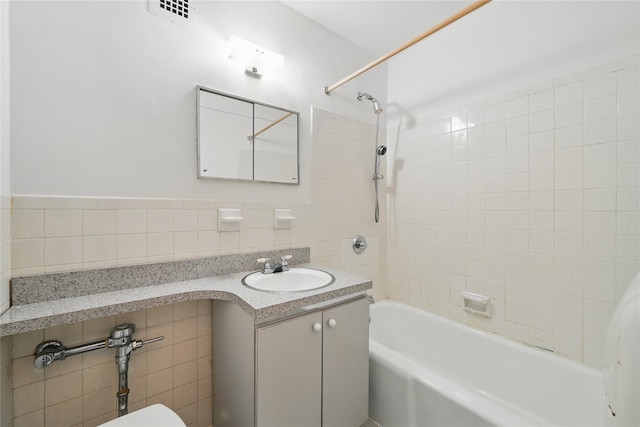 600 Locust St Unit 7C, Mount Vernon, NY 10552 - full bathroom with tile walls, vanity, tub / shower combination, and toilet