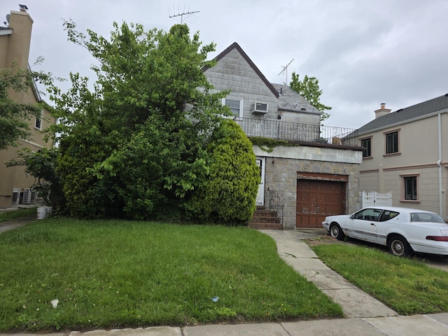 7636 173rd St, Fresh Meadows, NY 11366 - view of front facade featuring a garage, a front lawn, a balcony, and stone siding