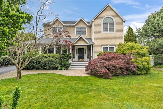 40 Carlisle Ln, East Islip, NY 11730 - view of front of home with a front lawn
