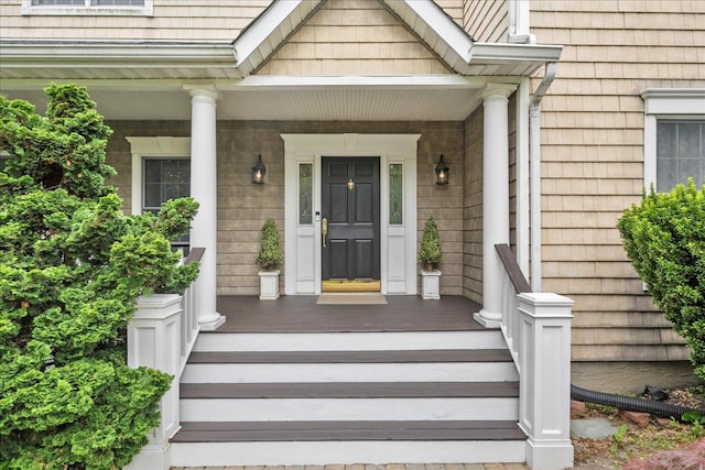 40 Carlisle Ln, East Islip, NY 11730 - doorway to property with a porch