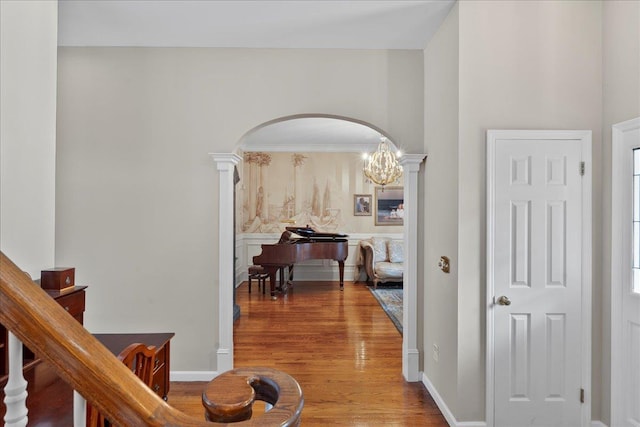 40 Carlisle Ln, East Islip, NY 11730 - hallway featuring arched walkways, wood finished floors, and ornate columns