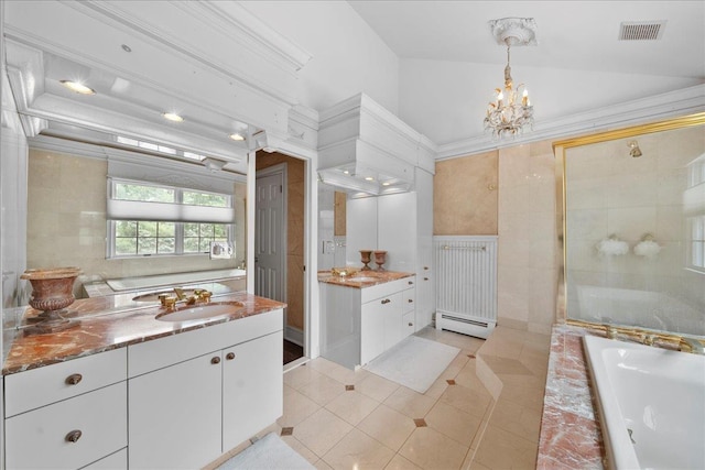 40 Carlisle Ln, East Islip, NY 11730 - bathroom featuring a baseboard radiator, two vanities, a garden tub, a tile shower, and a chandelier