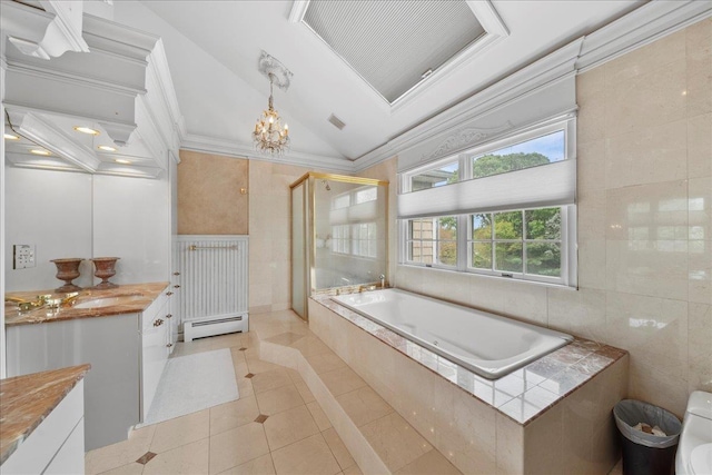 40 Carlisle Ln, East Islip, NY 11730 - full bath featuring baseboard heating, tile patterned flooring, vanity, lofted ceiling, and a garden tub