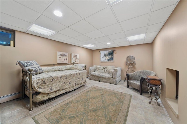 40 Carlisle Ln, East Islip, NY 11730 - tiled bedroom with a drop ceiling, baseboard heating, and recessed lighting