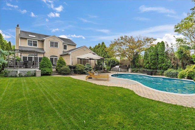 40 Carlisle Ln, East Islip, NY 11730 - outdoor pool with a gazebo, a lawn, a wooden deck, and a patio
