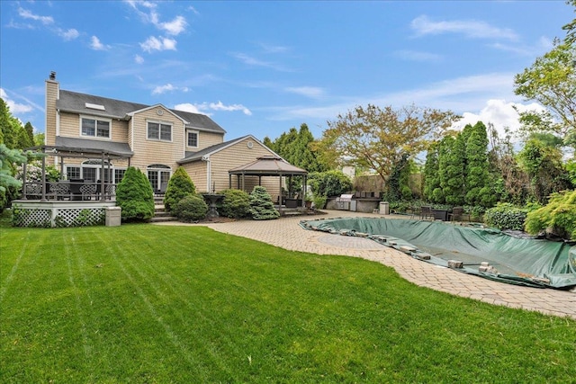 40 Carlisle Ln, East Islip, NY 11730 - view of pool featuring a gazebo, a lawn, a covered pool, and a wooden deck